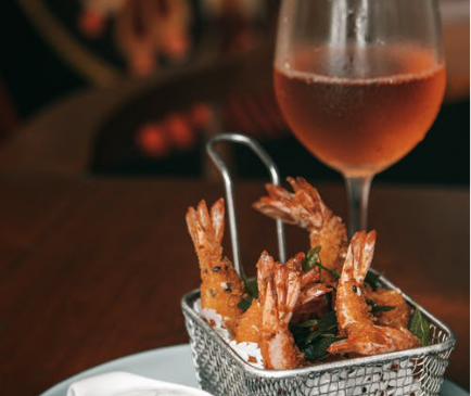 Prawns served with a yogurt dip and island-style fruit punch