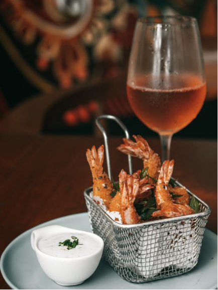 Prawns served with a yogurt dip and island-style fruit punch